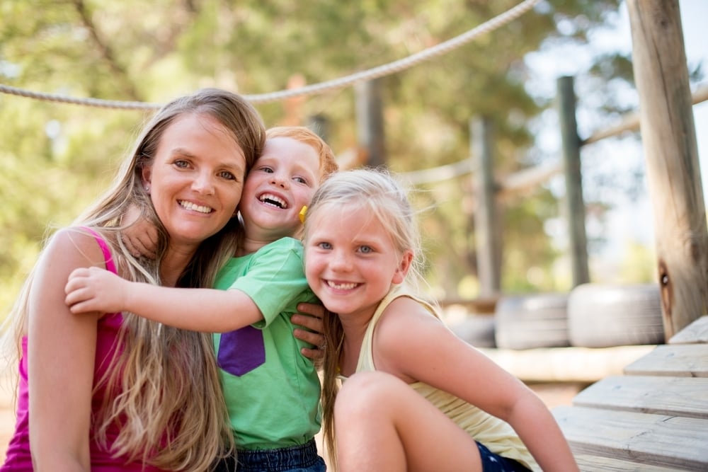 single mother with children after resolving timeshare financial stress